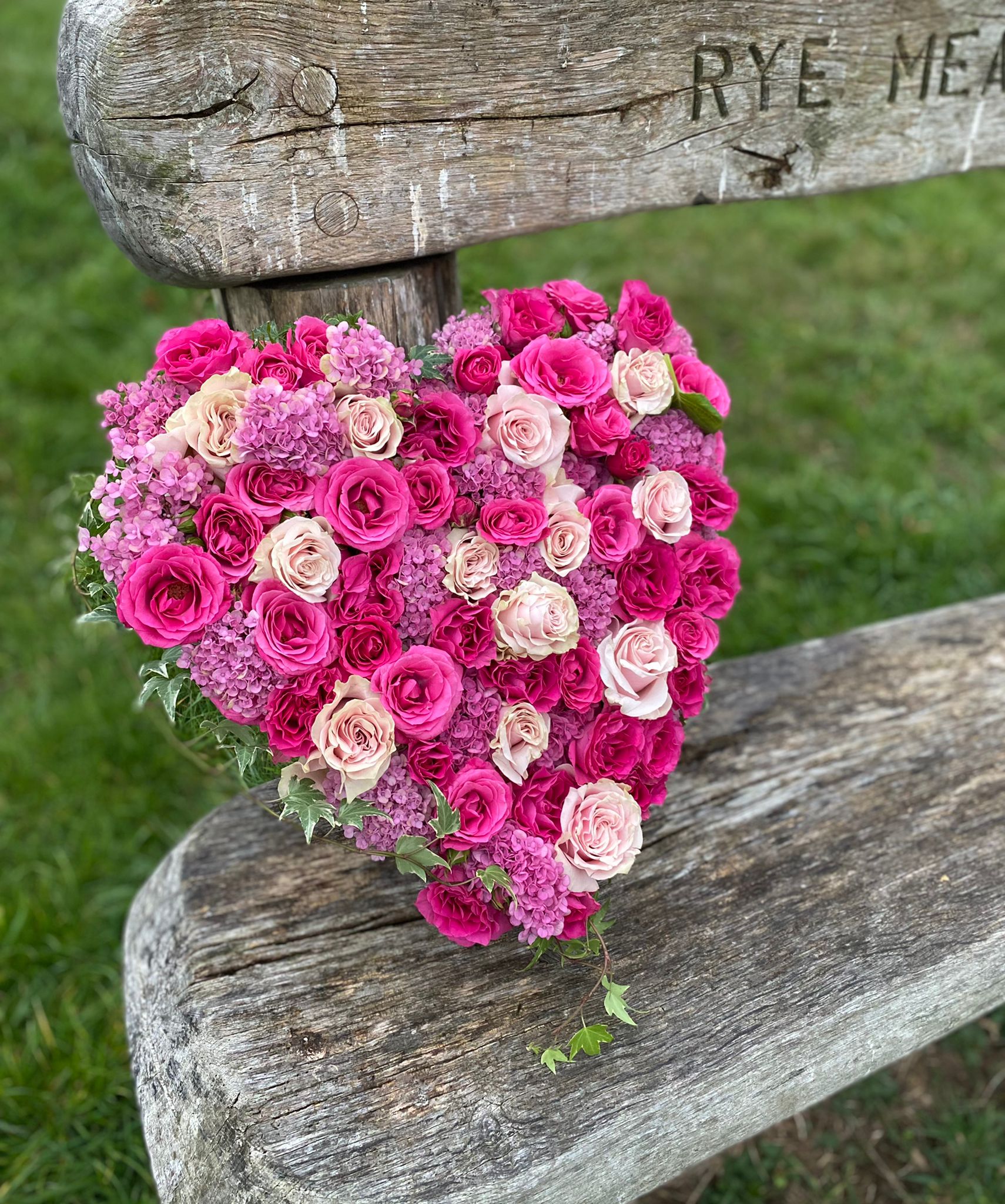 Pink heart shaped funeral wreath